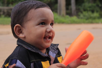 Close-up portrait of smiling boy