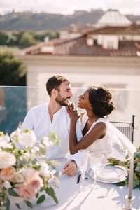 Young couple on white table