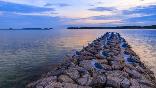 Scenic view of lake against sky during sunset