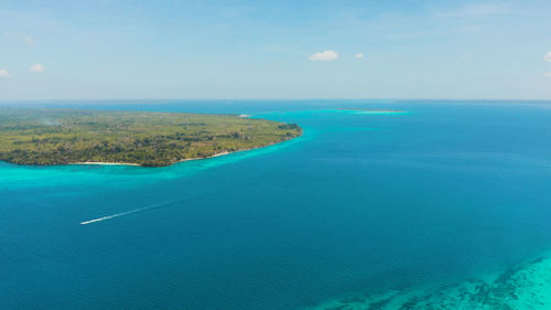 Tropical islands with coral reefs in the blue water of the sea, aerial view. balabac, palawan