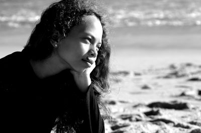 Side view of young woman in sea