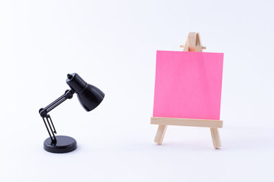 Close-up of empty chairs against white background