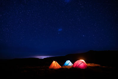 Low angle view of mountain against sky at night with stars, drakensberg. 