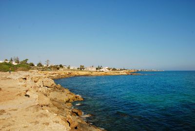 Scenic view of sea against clear blue sky