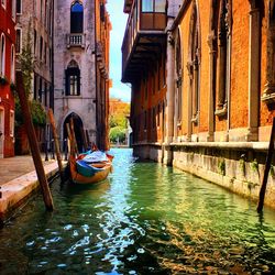 Boats moored in canal