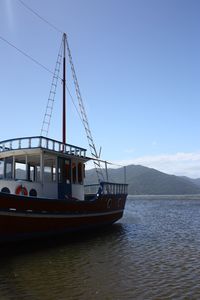 Ship sailing on sea against sky