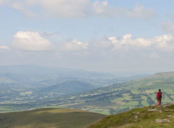 Woman walking through the hills of south wales