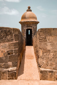 Backview leading to a coastal fort pillbox observing the coast in san juan, puerto rico.