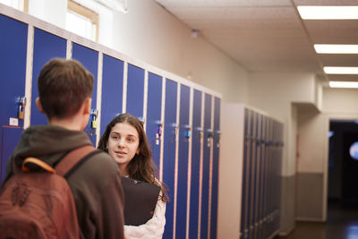 Teenagers talking at corridor
