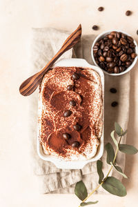 Traditional italian dessert tiramisu. coffee flavored dessert made of ladyfingers and mascarpone.