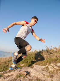 Full length of man running on mountain