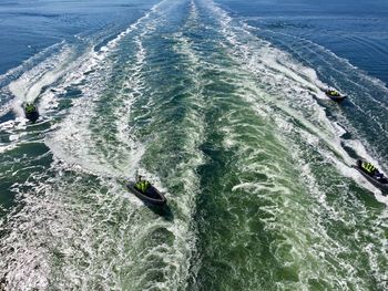 High angle view of people in speedboat at sea