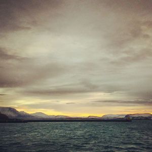 Scenic view of sea against cloudy sky