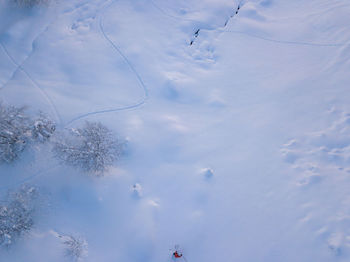 Low angle view of snow on field against sky