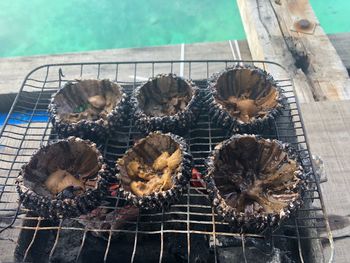 High angle view of meat on barbecue grill