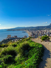 Scenic view of sea against blue sky