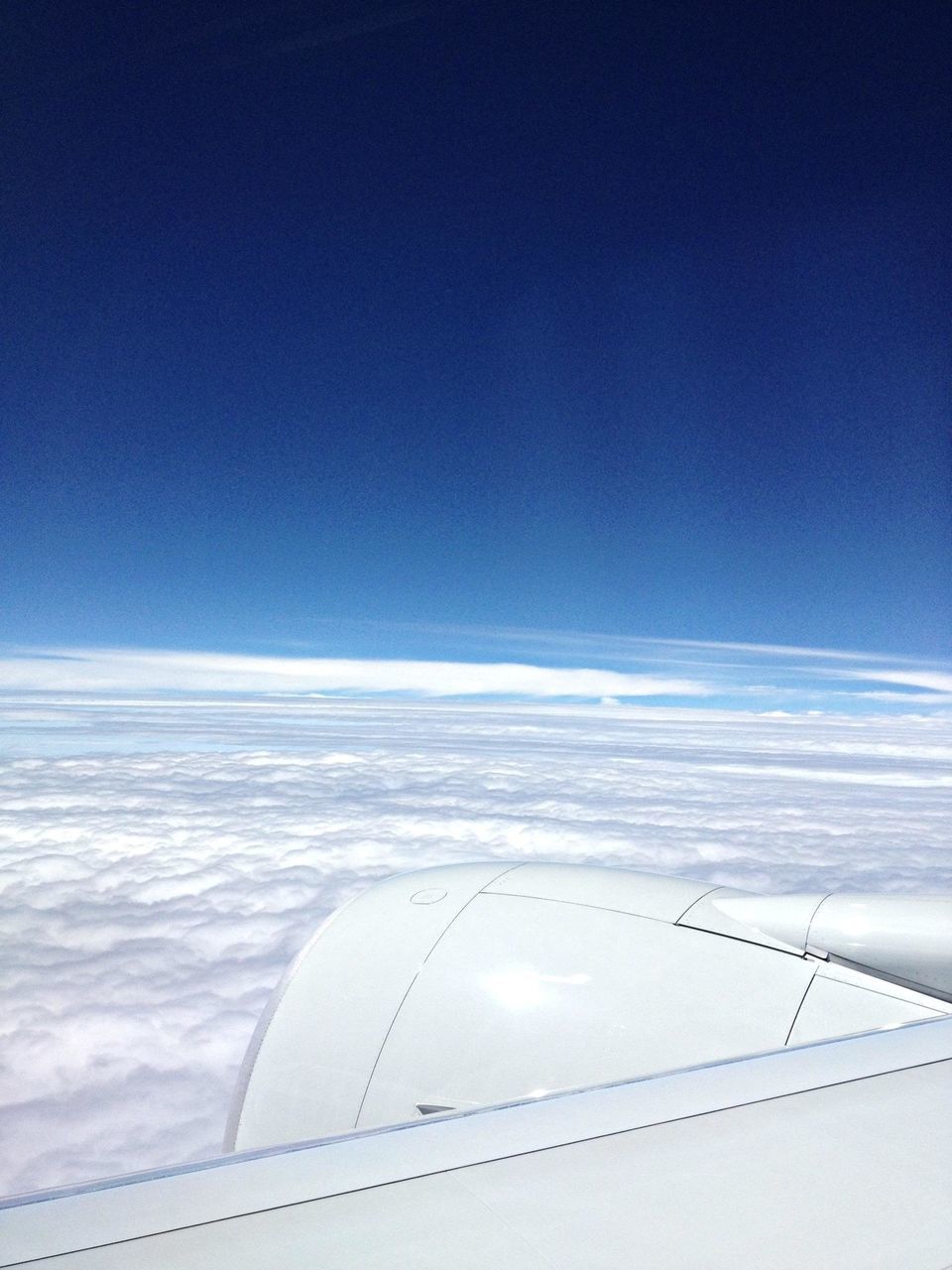 airplane, air vehicle, aircraft wing, flying, aerial view, blue, transportation, part of, mode of transport, cropped, scenics, sky, beauty in nature, nature, mid-air, travel, copy space, journey, airplane wing, on the move