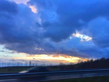 Scenic view of landscape against cloudy sky