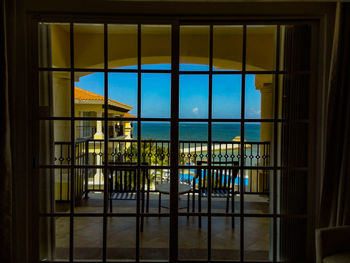 Close-up of sea against sky seen through window