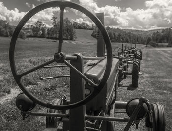 Close-up of metal field against sky