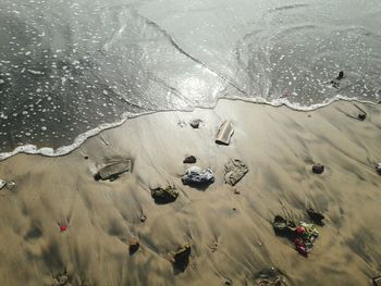 High angle view of footprints on beach