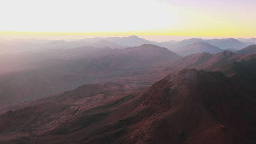 Scenic view of mountains against sky during sunset