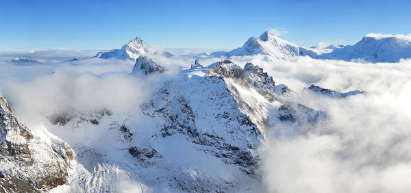 Scenic view of snow covered mountains