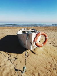 Lifeguard hut on beach against clear sky