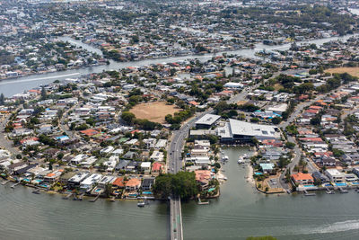 High angle view of buildings by road in city