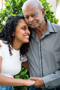 Portrait of a grandfather and granddaughter together