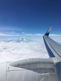 Airplane flying over blue sky