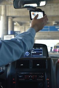 Midsection of man using smart phone