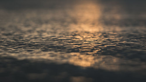 Surface level of water on land against sky