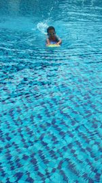 High angle view of person swimming in pool