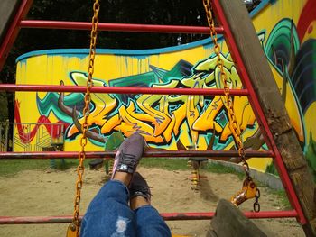 Low section of person relaxing in playground