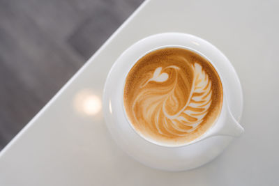 High angle view of cappuccino on table