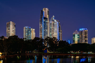 Illuminated buildings in city at night