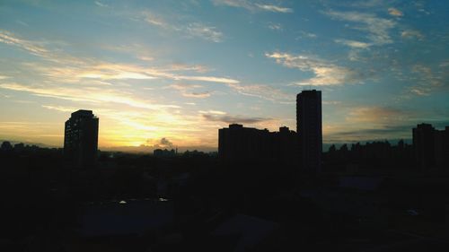 Cityscape against sky during sunset