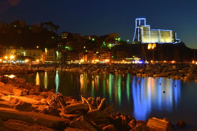 Reflection of city in water at night