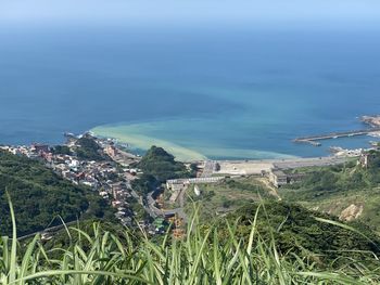 High angle view of city by sea