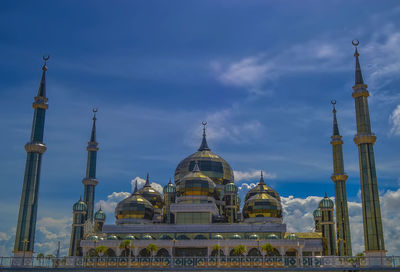 View of temple building against cloudy sky