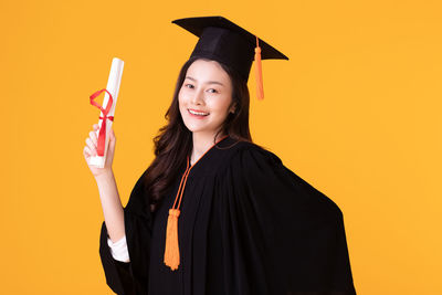 Portrait of a smiling young woman standing outdoors