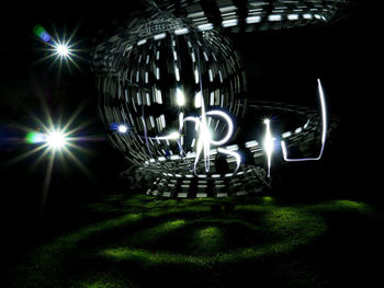 Illuminated lights on field at night