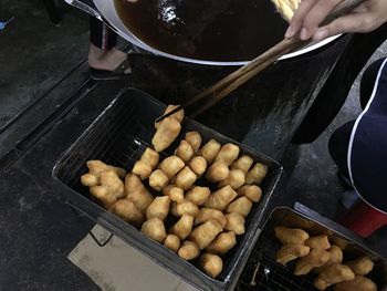 High angle view of person preparing food on barbecue grill