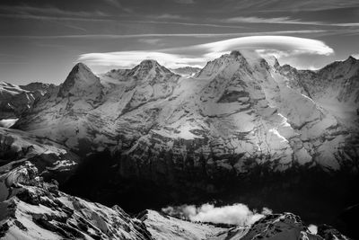 Scenic view of snowcapped mountains against sky