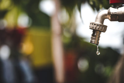 Close-up of water falling from faucet