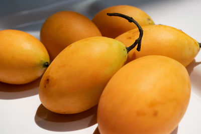 Close-up of oranges on table