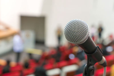 Close-up of microphone in auditorium