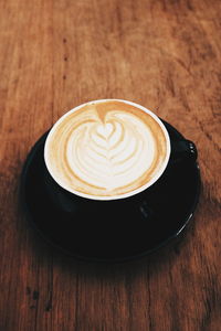 High angle view of cappuccino on table