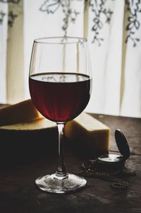 Close-up of wine glasses on table